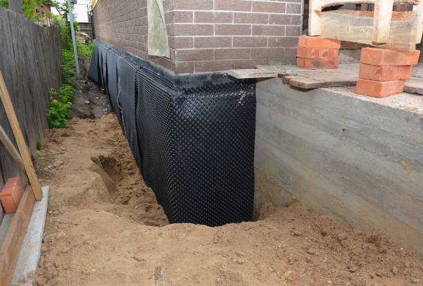 SJ Waterproofing Pros technician performing targeted Exterior Waterproofing assessment in Sonyea, NY